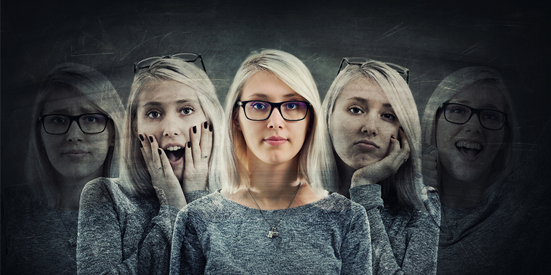 woman with multiple faces depicting different personalities